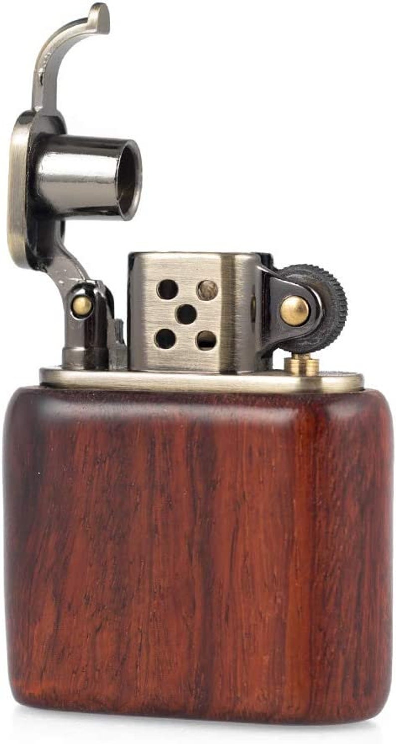 May include: A brown wooden lighter with a silver and black metal top. The lighter has a flip top lid and a small wheel on the side.