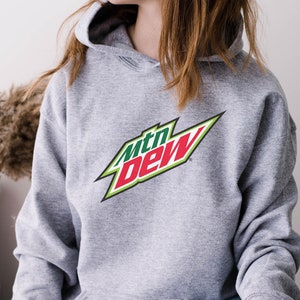 May include: A gray hooded sweatshirt with a green, red, and white Mountain Dew logo printed on the front.