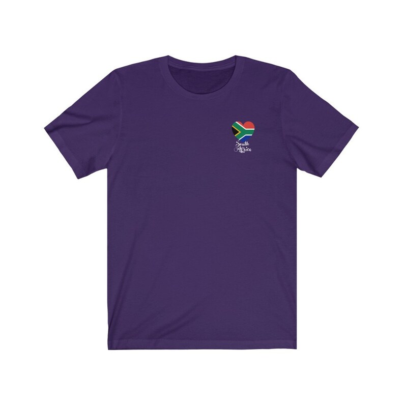May include: Purple short-sleeved t-shirt with a heart-shaped South African flag graphic and the text "South Africa" in white cursive.