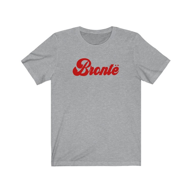 May include: A heather grey t-shirt with a red retro-style graphic that says "Bront&euml;"