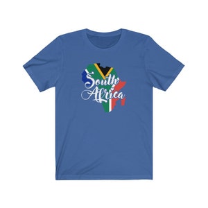 May include: A royal blue t-shirt with a white outline of the continent of Africa, filled with the colors of the South African flag. The text "South Africa" is written in white cursive script.