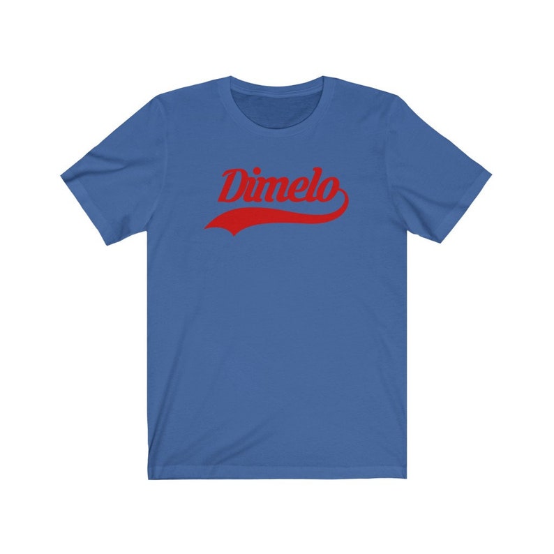 May include: A royal blue t-shirt with a red curved graphic that says "Dimelo".