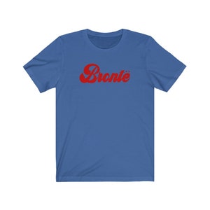 May include: A blue short-sleeved t-shirt with a red retro-style graphic that says "Bronte" on the front.
