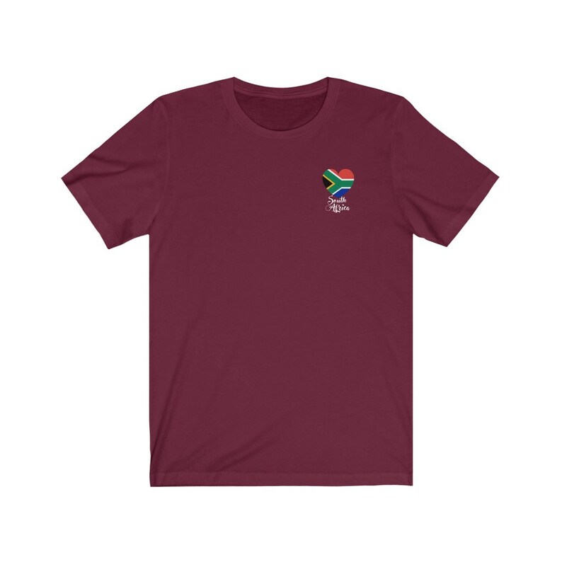 May include: Burgundy short-sleeved t-shirt with a heart-shaped South African flag graphic and the text "South Africa" underneath.