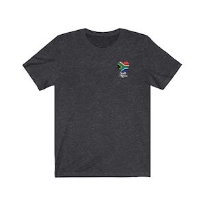 May include: Dark heather grey t-shirt with a small heart-shaped graphic of the South African flag and the text "South Africa".