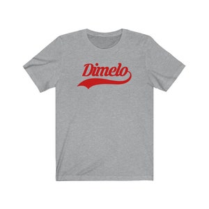 May include: A heather grey t-shirt with a red curved graphic that says "Dimelo".