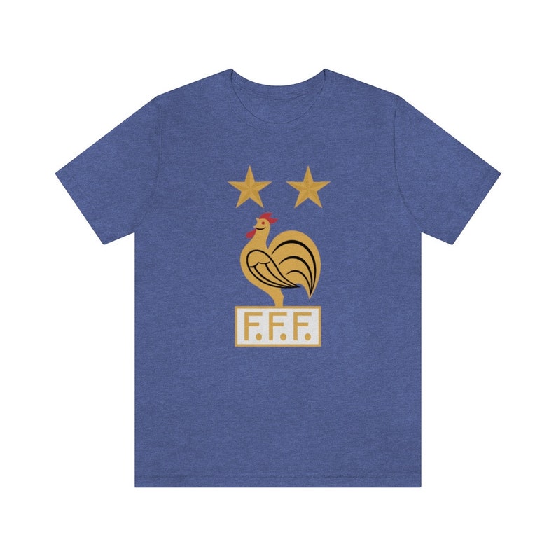 May include: A blue t-shirt with a gold rooster and two stars above it. The text "F.F.F." is below the rooster.