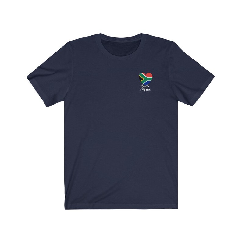 May include: A navy blue t-shirt with a heart-shaped South African flag design and the text "South Africa" in white cursive lettering.
