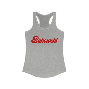 May include: A gray tank top with a red retro-style font that says "Bukowski" on the front.