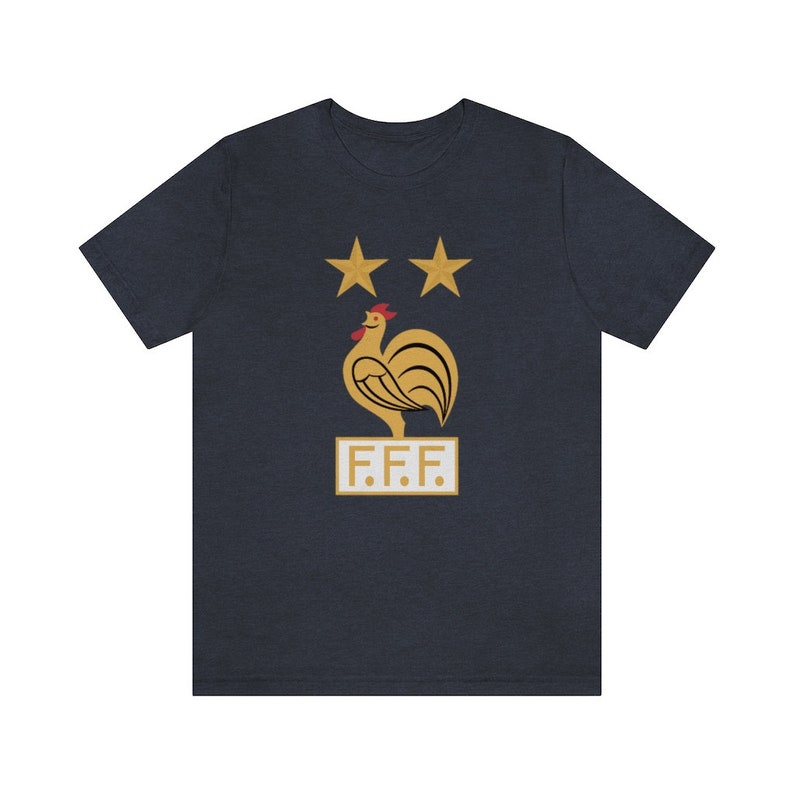 May include: A navy blue t-shirt with a gold rooster and two stars above it. The text "F.F.F." is below the rooster.