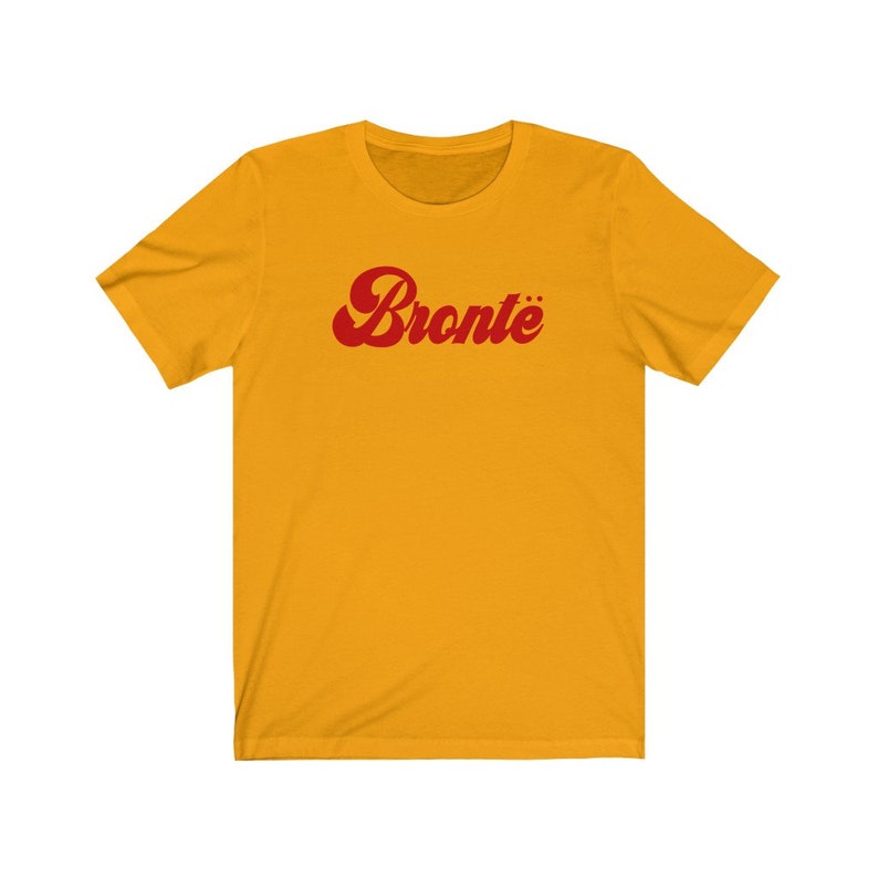 May include: A yellow short-sleeved t-shirt with a red retro-style graphic that says "Bronte".