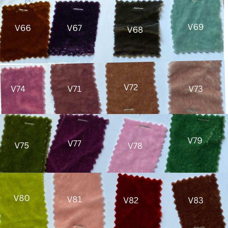 May include: A selection of velvet fabric swatches in a range of colours, such as brown, purple, green, pink, and teal. Each swatch is labelled with a white tag, displaying the different colour options.