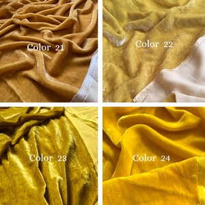 May include: Four velvet fabric swatches in gold and yellow hues. Each swatch is labelled with a colour number: 21, 22, 23, and 24. The fabric has a soft, textured appearance with visible folds and highlights.