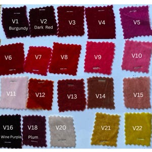 May include: A selection of 22 fabric swatches in a range of colours, including reds, pinks, and golds. Each swatch is labelled with a "V" number and a colour name, such as "Burgundy," "Dark Red," and "Wine Purple."