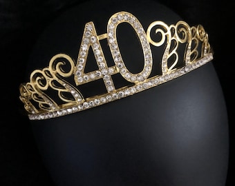 May include: Gold-colored tiara with clear rhinestones, featuring the number "40" in the center.