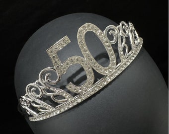 May include: Silver tiara with rhinestones, featuring the number 50.