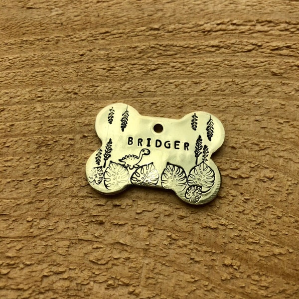 Jurassic Jungle Hand Stamped Metal Pet ID Tag | Bone Shaped Custom Name Tag | Dinosaur Themed Brontosaurus T-Rex Nametag for Cats Dogs