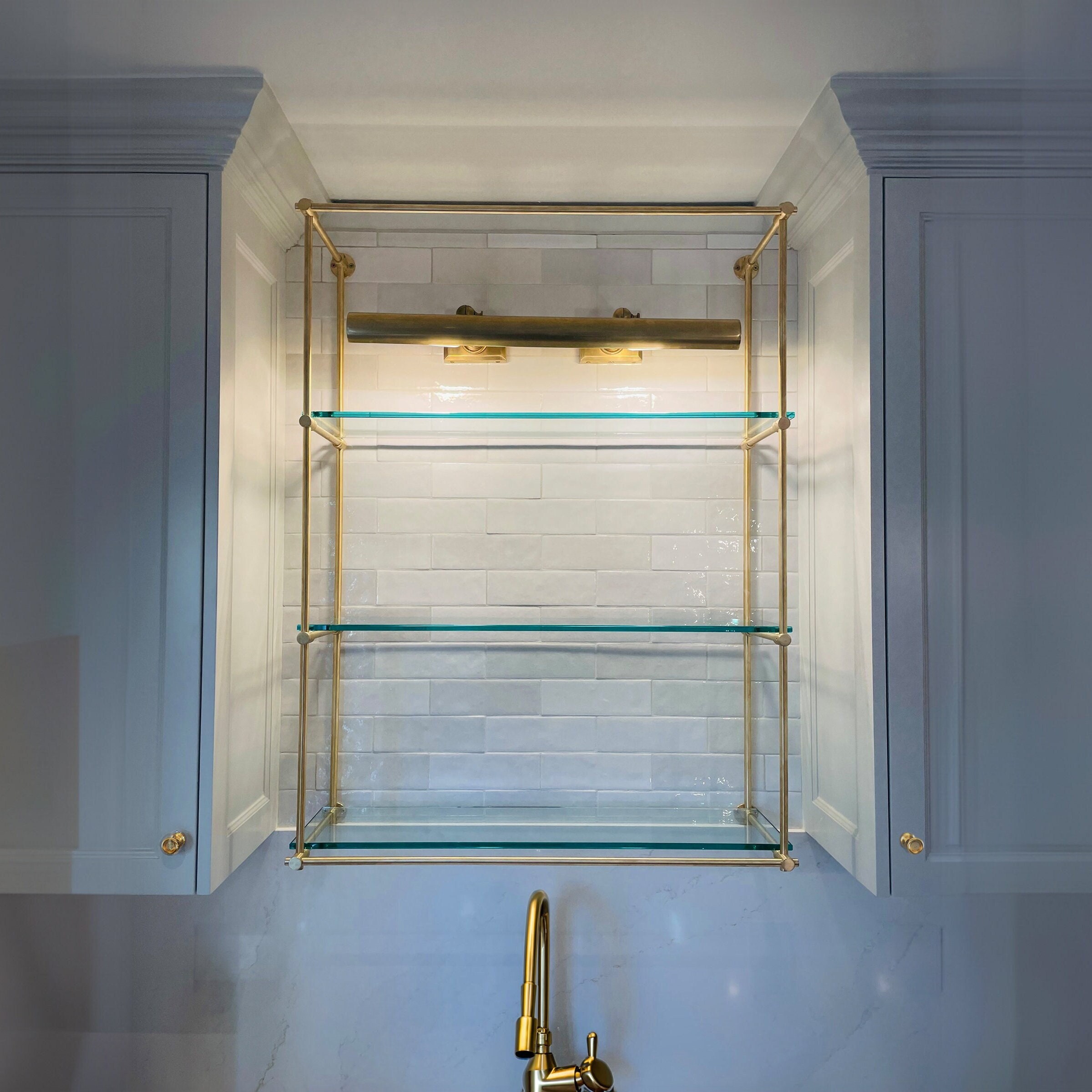 Customizable wall mounted brass shelving. Up to 50'' height - 35'' width - 15'' depth - 3 shelves. Unlacquered satin and solid brass.