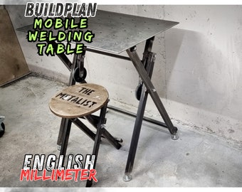 May include: A black metal welding table with wheels and a metal top. The table is adjustable in height and has a black metal stool with a wooden seat. The table is labeled "BUILDPLAN MOBILE WELDING TABLE" and "ENGLISH MILLIMETER".