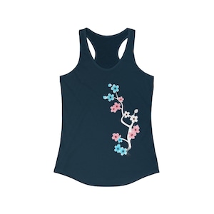 May include: A navy blue racerback tank top featuring a white branch with pink, blue and white flowers.