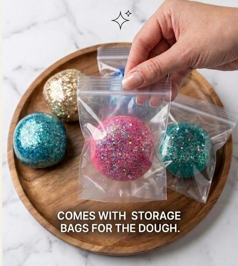 May include: Several spherical balls of glittery dough in various colors including pink, blue, gold, and teal. Each ball is individually packaged in a clear plastic resealable storage bag. The text on the image reads, COMES WITH STORAGE BAGS FOR THE DOUGH.