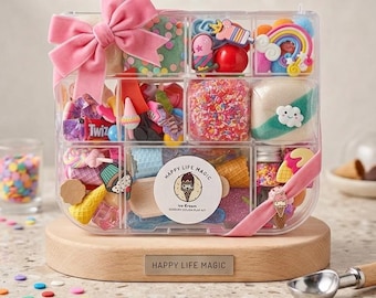 May include: A clear plastic organizer box filled with colorful sensory dough, miniature ice cream cones, sprinkles, and charms. The box is adorned with a pink ribbon and a label reading Happy Life Magic Ice Cream Sensory Dough Play Kit.