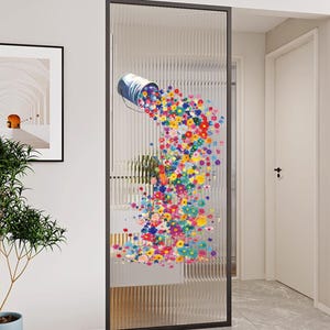 May include: A glass door with a black frame features a design of a blue paint bucket spilling colorful flowers. The flowers cascade down the glass, creating a vibrant and artistic display. The door is in a hallway.