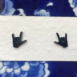 stainless steel earrings in the i love you handshape