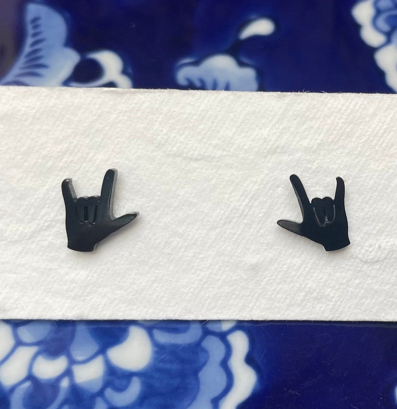 stainless steel earrings in the i love you handshape
