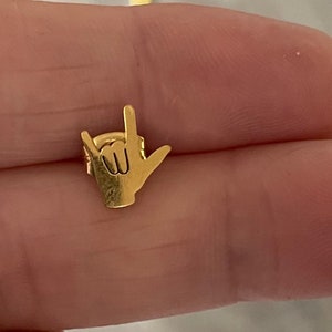 stainless steel earrings in the i love you handshape