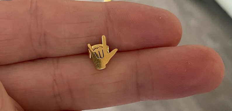 stainless steel earrings in the i love you handshape