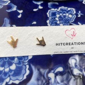 stainless steel earrings in the i love you handshape
