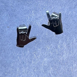 stainless steel earrings in the i love you handshape