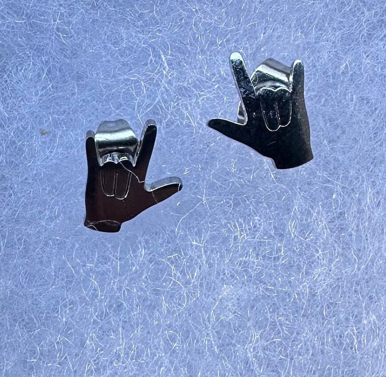 stainless steel earrings in the i love you handshape