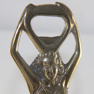 Art deco figural bottle opener/caplifter