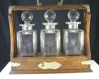 Antique whisky tantalus/decanterset/tantalus