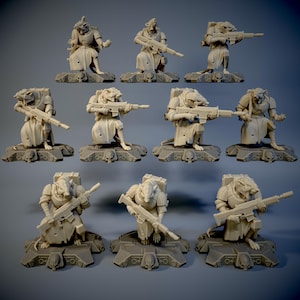 Può includere: Un set di 10 miniature di ratti antropomorfi, ciascuna con un'arma in mano e in piedi su una base. Le figure sono dipinte in uno schema di colori marrone tenue.