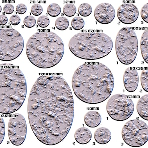 May include: A set of 15 round and oval-shaped miniature bases for tabletop gaming. The bases are made of a textured, gray material and range in size from 25 mm to 170 mm. The bases are numbered 1, 2, and 3.