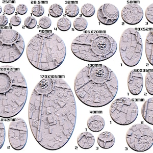 May include: A set of 14 round and oval plastic bases for miniature figures, ranging in size from 25mm to 170mm. The bases are textured with a stone-like pattern and feature various details, including circles, lines, and a central design.