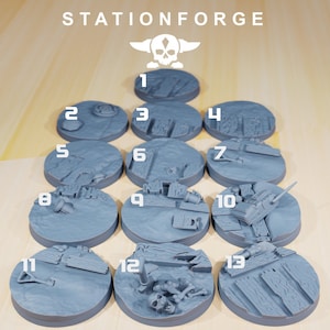 May include: Thirteen grey plastic gaming bases with different textured surfaces. Each base is numbered 1 through 13. The bases are arranged in a pyramid shape. The text "STATIONFORGE" is at the top of the image.