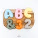 → auf Etsy ansehen: 3D Bubble Buchstaben, Zahlen, Symbole in Keramik Optik | Deko | Personalisierbar in Farbe & Größe | Initialen Deko | Bubble Letter 3D Bubble Buchstaben, Zahlen, Symbole in Keramik Optik | Deko | Personalisierbar in Farbe & Größe | Initialen Deko | Bubble Letter