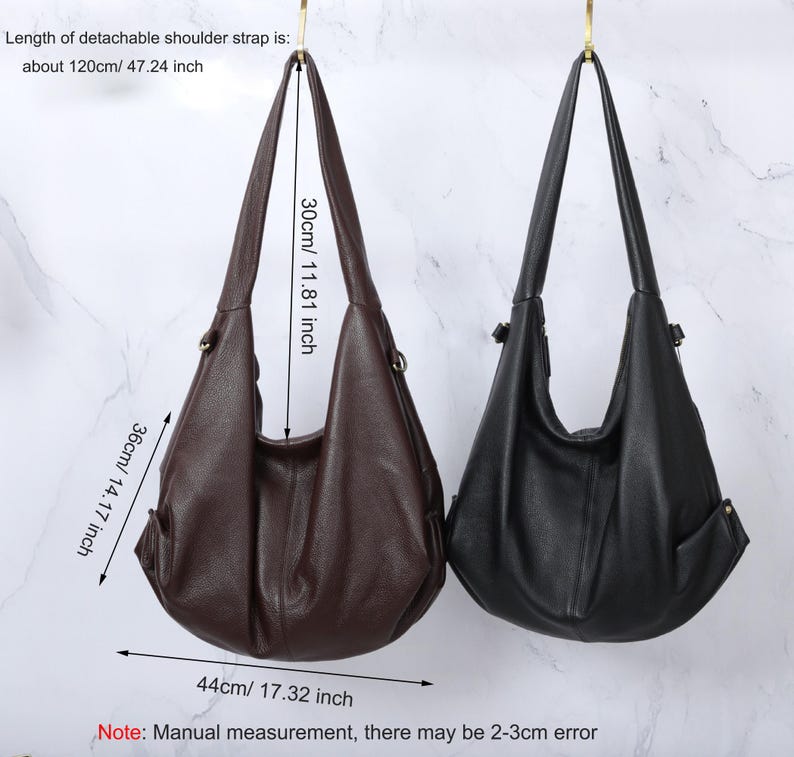 May include: Two hobo-style shoulder bags in dark brown and black with a textured finish. Dimensions are 17.32 inches wide by 14.17 inches high, with a 11.81-inch strap drop. The detachable shoulder strap measures 47.24 inches in total length.