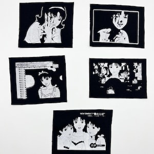 May include: Five black and white patches with anime-style illustrations. The patches show different scenes of a young woman, some with text. The patches are square and appear to be made of fabric.