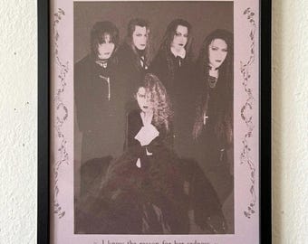 May include: A framed poster featuring the band "Malice Mizer" in sepia tones. The image shows six people in dark clothing, with long hair and dramatic makeup. The text "Malice Mizer" is at the top, with the phrase "I know the reason for her sadness" at the bottom.