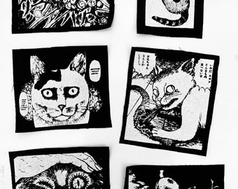 May include: Six black and white iron-on patches featuring a manga style cat with different expressions. The text on the patches reads "wa-  such a thing  don't eat it  I don't want to  such a thing  don't eat it  Older brother  Somehow  do it  AMHONE  HUR HUR  PURRR".