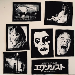 May include: A collection of black and white patches featuring imagery from the horror film, The Exorcist. The patches include scenes of a possessed girl, a demonic face, and the text "THE POWER OF CHRIST COMPELS YOU!"