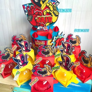 1 Deadpool and Wolverine Cake topper + 12 Treat Boxes + 12 tags  requested by a customer.