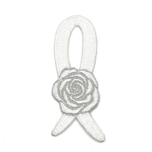 May include: White embroidered iron-on patch of a white ribbon tied into a bow with a silver embroidered rose in the center.