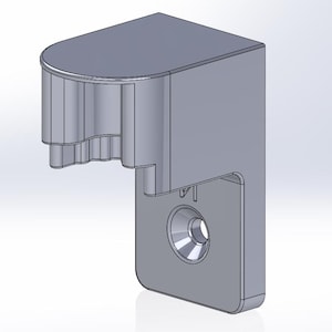 Peut inclure: Un support gris rendu en 3D avec un dessus arrondi et une section cylindrique et nervurée. Le support a une base rectangulaire avec un trou circulaire. Le design est simple et fonctionnel.