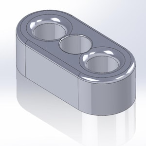 Peut inclure: Un connecteur en plastique gris avec trois trous ronds. Le connecteur est conçu pour maintenir des câbles ou des fils en place.